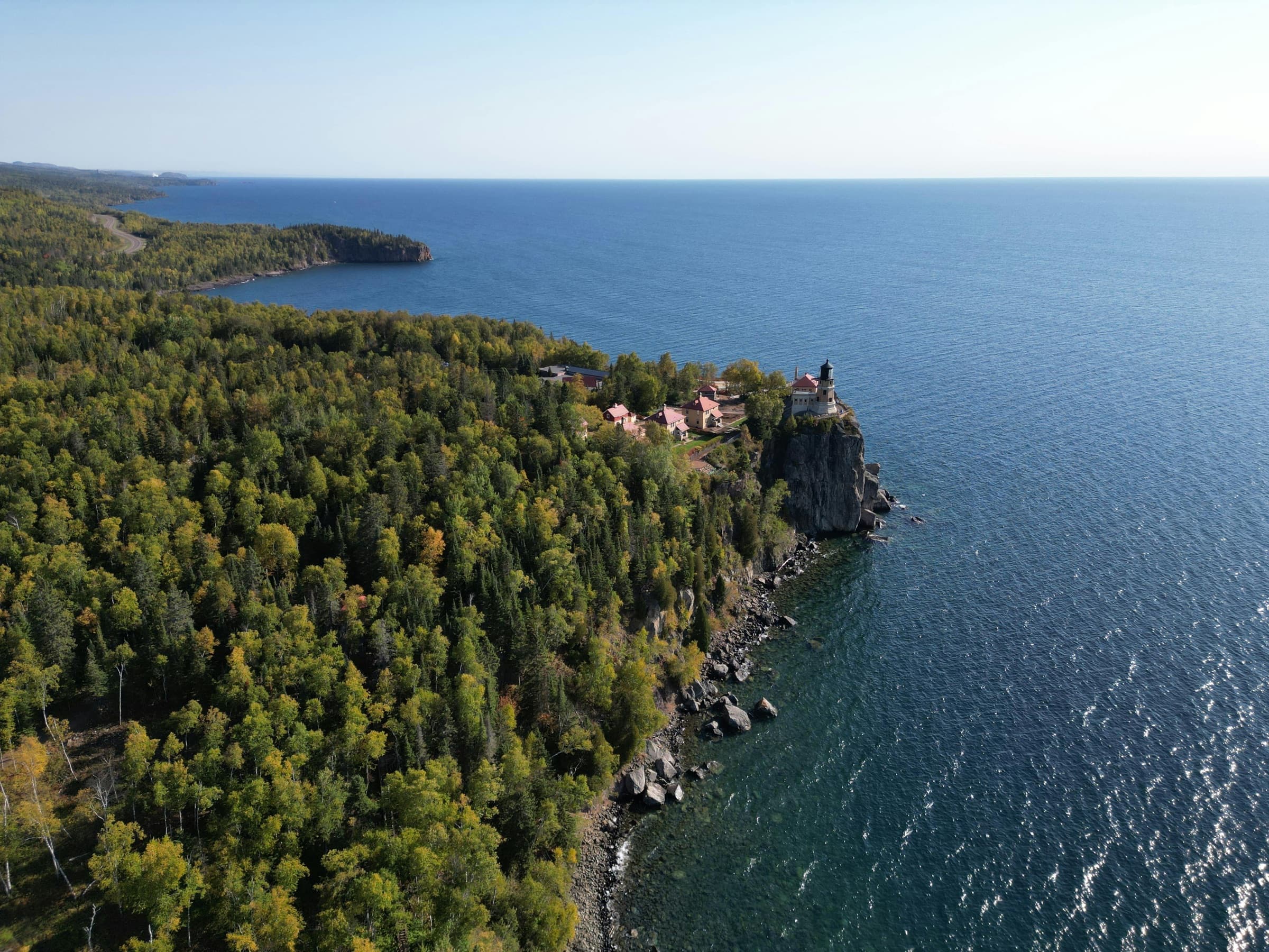 Aerial of Split Rock Lighthouse on Lake Superior: the cliff, the forest, the open water